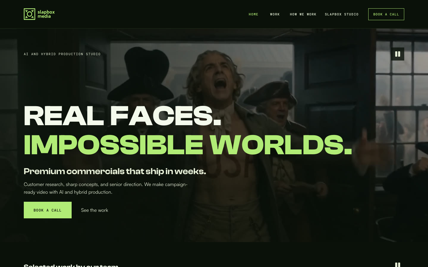 The live slapboxmedia.co home page at 1440 by 900: the headline Real faces. Impossible worlds. over a film still, with the selected-work row beneath it
